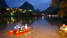 Rescuers search for missing victims in the Peach Blossom River after two dragon boats sank in Guilin, Guangxi Province, China, on 21 April 2018