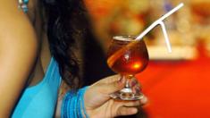 A Sri Lankan woman holds a cocktail during a drinks competition in Colombo, 26 February 2017