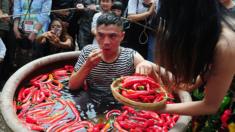 A contestant takes part in a chilli pepper-eating competition in China