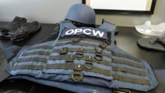 Bullet-proof vest and helmet used by OPCW staff, as demonstrated at its headquarters in The Hague, 20 April