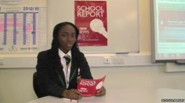 A School Reporter reading from a cue card for their news broadcast