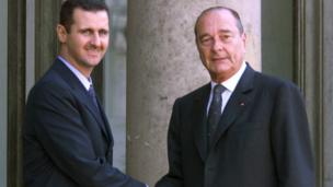 Syrian President Bashar al-Assad is greeted by French President Jacques Chirac before their meeting at the Elysee Palace in Paris. 25 June 2001
