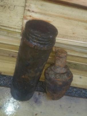 A photo of the rusted bomb device.