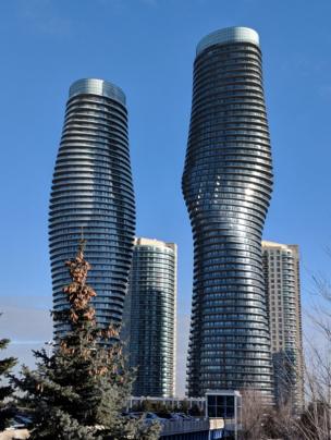 Two tall silver skyscrapers