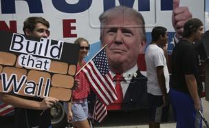 Trump supporters with a sign that says 