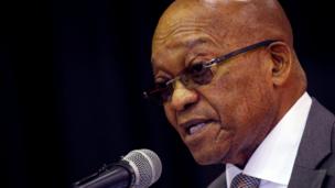 South African President Jacob Zuma speaks into a microphone