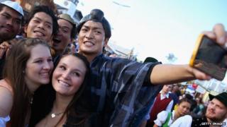 Young people gather for a selfie