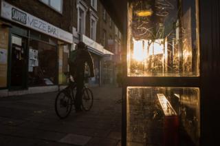 The sun sets on the street