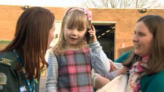 Call handler Sarah Morris, Emma and her mum Catherine and baby brother