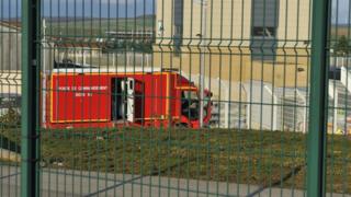 An emergency vehicle at a French nuclear waste site after a deadly rock slide