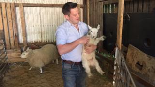 Alistair Armstrong and one of his lambs