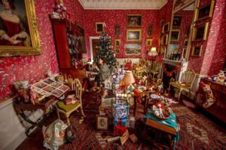 A room full of Christmas presents and decorations.