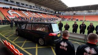 Funeral cortege passing through Bloomfield Road