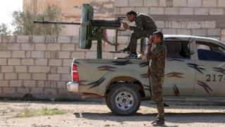 Syrian Democratic Forces fighters look at Islamic State positions in Hassakeh province (19 February 2016)