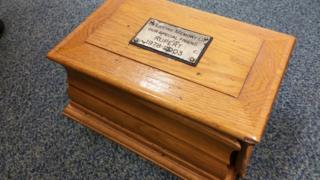 Wooden box containing ashes