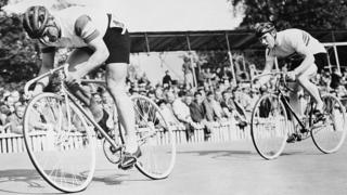 Charles Bazzano (left) is followed by Reg Harris
