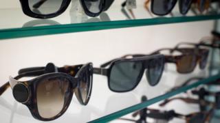 Sunglasses on a shelf