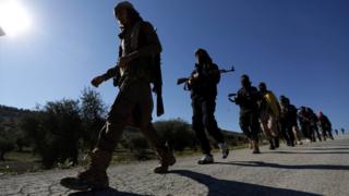 Free Syrian Army fighters marching near Afrin on 17 March 2018