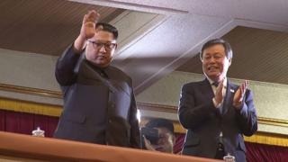 North Korean leader Kim Jong-un (L) and South Korean Culture, Sports and Tourism Minister Do Jong-hwan (R) during a rare concert by South Korean musicians at the 1,500-seat East Pyongyang Grand Theatre in Pyongyang on 1 April 2018