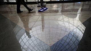 Person cleaning a floor