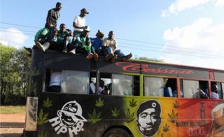 Fans of Kenyan club Gor Mahia cheer on top of a matatu after their team played against during Tunisian club Esperance during the CAF Champions League first round match between Gor Mahia and Esperance Tunis, in Machakos, Kenya, 07 March 2018.