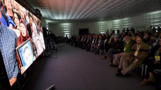 A picture taken on November 17, 2016, in Tunis shows relatives of abuse victims watching a live broadcast of the testimonials of the abuse victims before the The Truth and Dignity Commission (IVD).