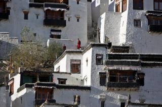 Young monks take a break from their studies inside Thiksey Monastery in Ladakh, India.