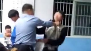 Screengrab of video showing Anhui high school students and teacher in a classroom brawl, taken on 21 April 2016
