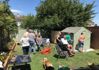Volunteers working on Darren Black's garden