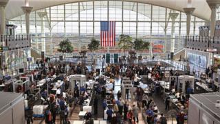 Passengers move through a main security checkpoint at the Denver International Airport on November 22, 2010 in Denver, Colorado.