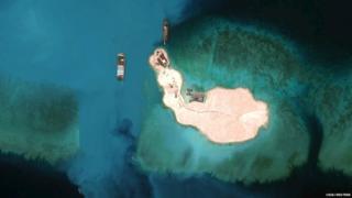 cargo is unloaded onto the shore of Mischief Reef, located 216 km (135 miles) west of the Philippine island of Palawan