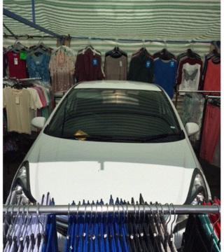 Car in clothes stall