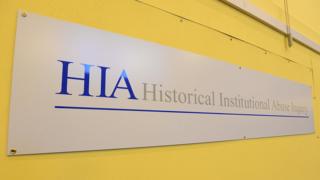 A sign that reads: Historical Institutional Abuse Inquiry