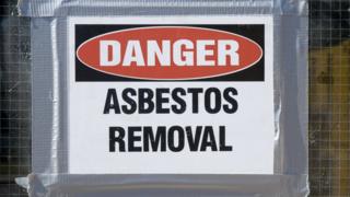 A picture of danger asbestos removal sign