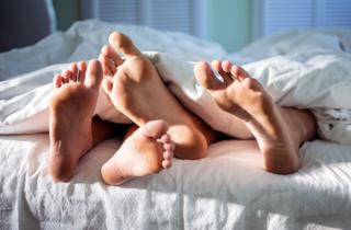 Detail of feet in a bed