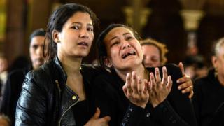 Female mourners react during the funeral of Copts who died a day earlier in the bomb explosion in Alexandria, Monastery of Saint Mina outside of Alexandria, 10 April