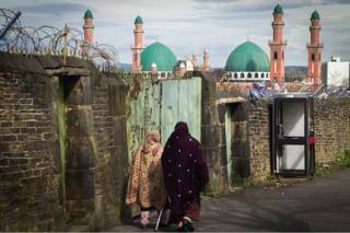 Women walk towards mosque in Bradford