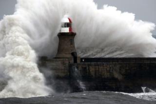 Giant waves crash over Souter Lighthouse in South Shields in Tynemouth