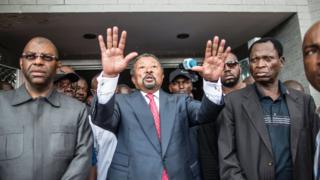 Jean ping outside his party headquarters