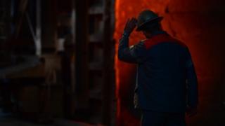 A worker at a steel factory in Germany