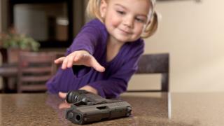 Little girl with gun