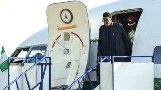 Nigerian President Muhammadu Buhari disembarks upon arrival at the Waterkloof Military air base in Pretoria, South Africa - 13 June 2015