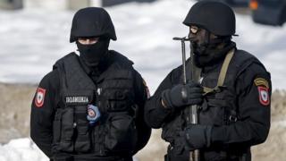 Two armed Bosnian police stand guard in this 2016 file picture