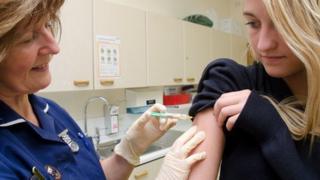 girl getting the vaccine