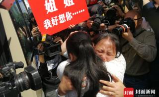Kang Ying and her mother Liu Dengying hug after being reunited