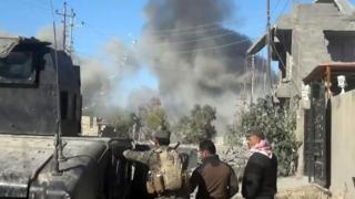 Smoke rises following a US-led coalition air strike in Ramadi on 25 December 2015.