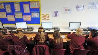 Schoolchildren working at a computer