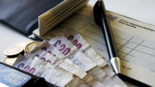 chequebook and cash