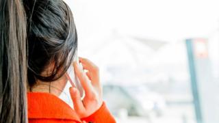 woman on phone from back