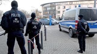 Policemen stand in front of the Higher Regional Court in Celle near Hanover as Safia S is sentenced